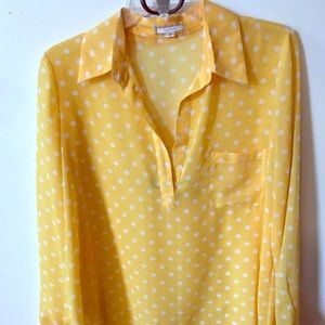 yellow and white polka dot blouse